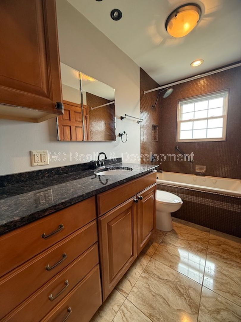 *** 3 BDRM - 2 BTH / FENCED YARD W LRG DECK / SS APPL / FINISHED BASEMENT / ATTACHED GARAGE *** property image