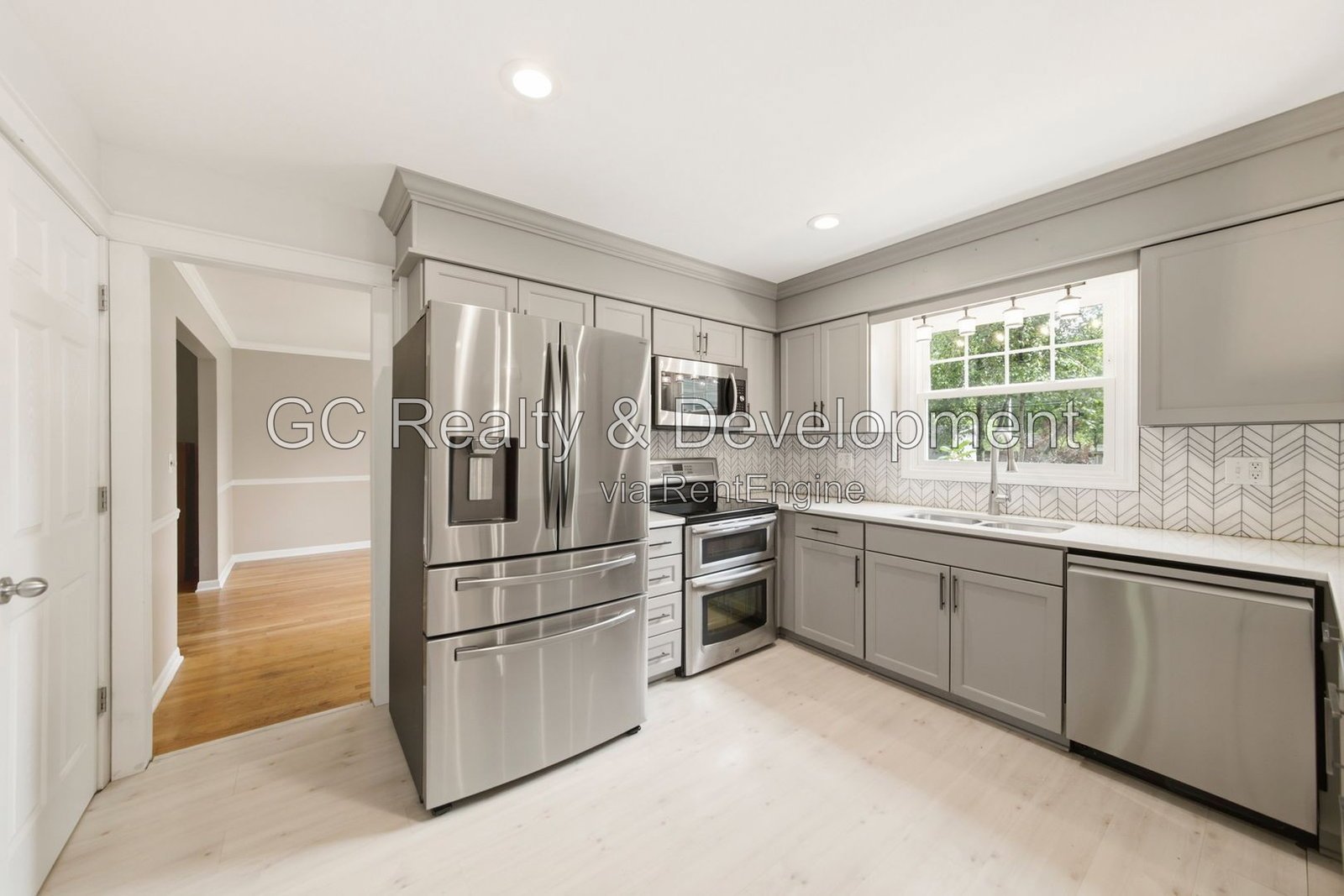 *** 4BR - 3BA / Hardwood Floors / Fenced Yard / Central Air / Garage / In-Unit Laundry *** property image