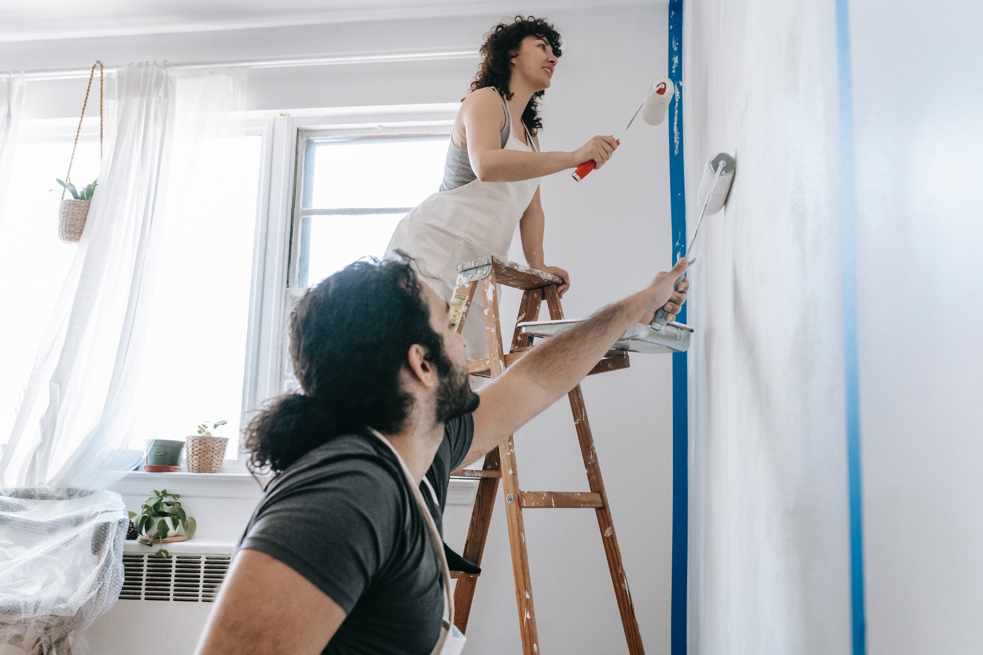 people painting wall